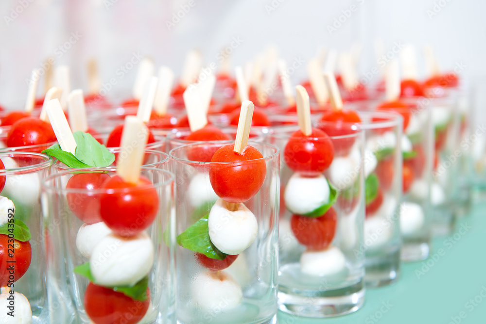Poster Mini caprese cherry tomatos and mini mozzarella in a glass - Finger food – Wandbild