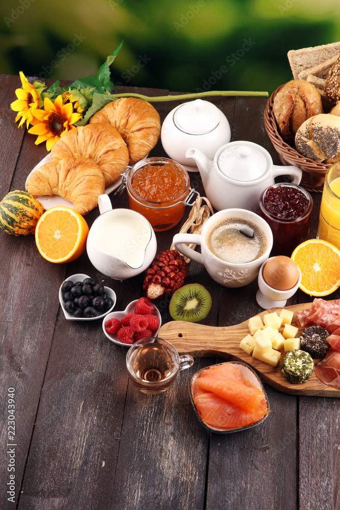 breakfast on table with bread buns, croissants, coffe and juice. breakfast on table with bread buns, croissants, coffe and juice.