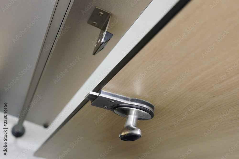 Open unlocked cubicle door ajar at gym changing room Open unlocked cubicle door ajar at gym changing room