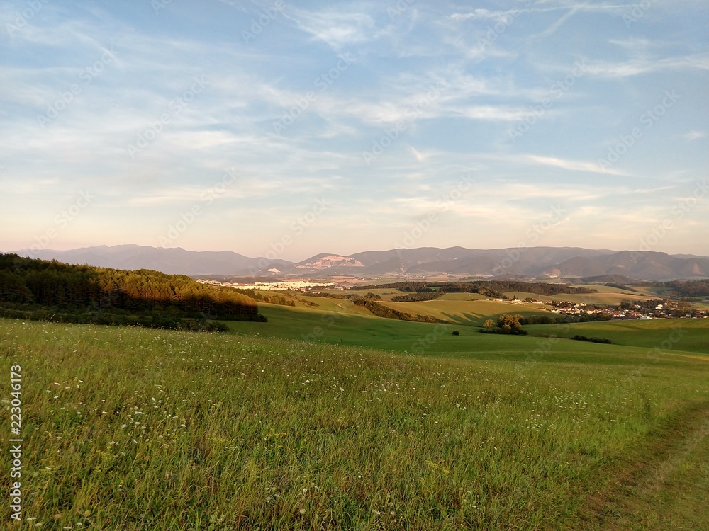 Obraz premium Sunrise and sunset over the hills and town. Slovakia 