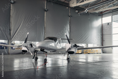 Private turbo-propeller airplane in hangar, nobody