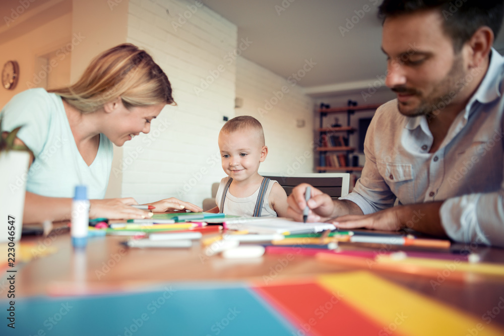 Young parents with child drawing Young parents with child drawing