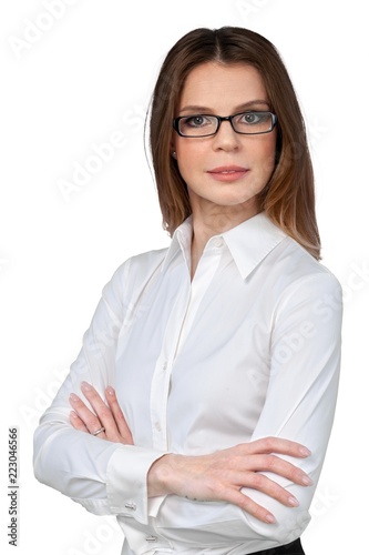 Businesswoman With Glasses And Arms Folded - Isolated