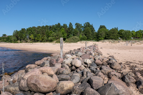 old stone brakewater in the Baltic sea photo
