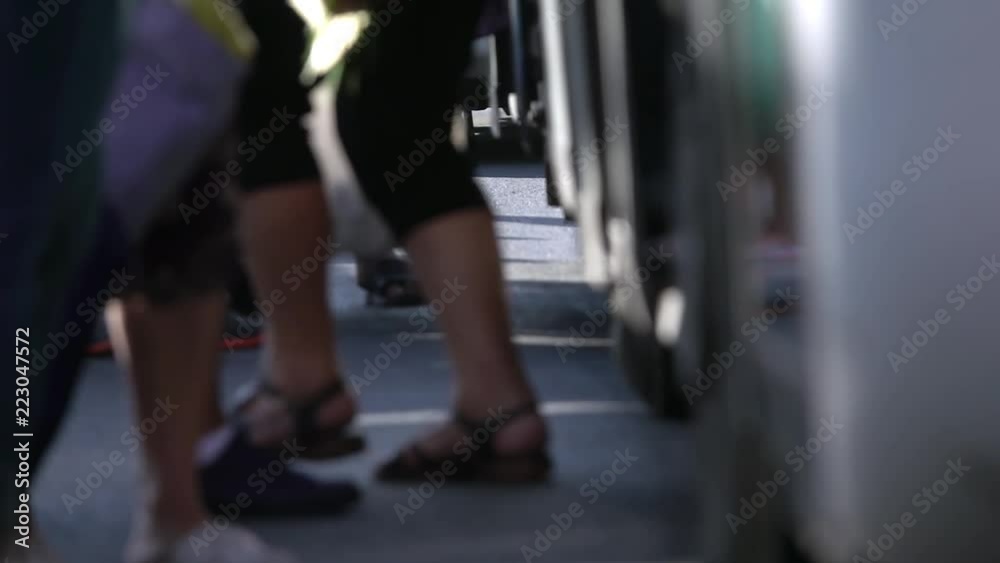 People getting off the bus in station. Slow motion
People getting off the bus in station. Slow motion