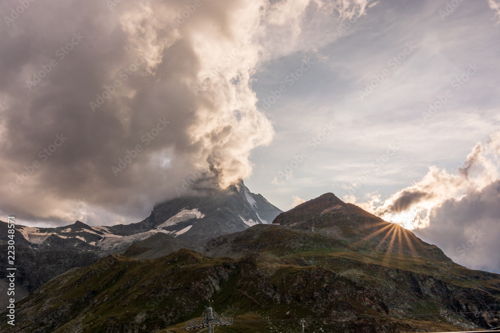 Clouds swirling around the peak of the Matterhorn during sunset