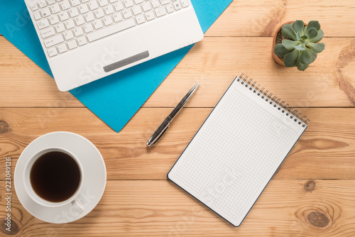 Office table with cup of coffee 