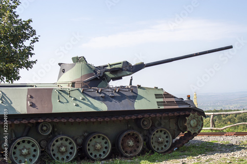 Heavy tank military vehicle with landscape background