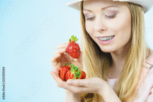 Young woman with fresh strawberries