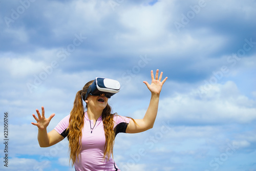 Woman wearing VR outside