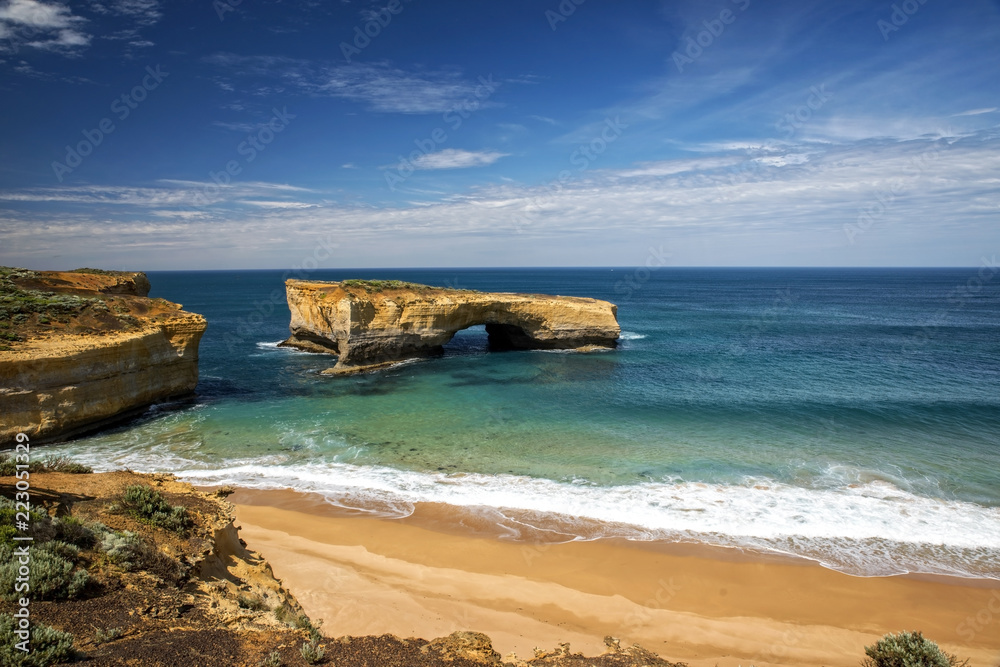 Victoria - Australia – rough costline with sandy beach and sunny blue sky