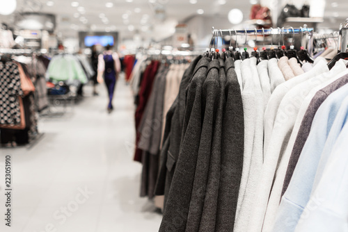 Women's coats on hangers in the store