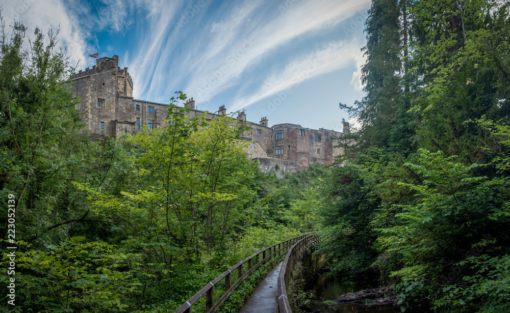 Panoramic view on Skipton Castle as seen from the footbridge in Skipton Woods