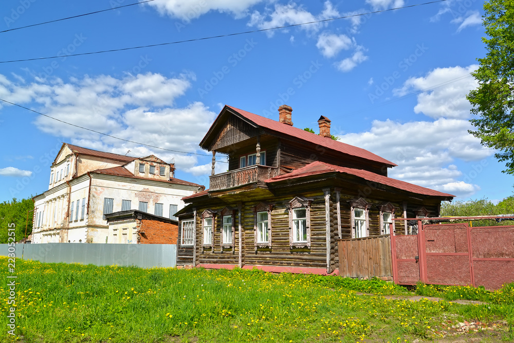 Wooden house with the mezzanine and the stone mansion of the 19th century. Uglich, Yaroslavl region
