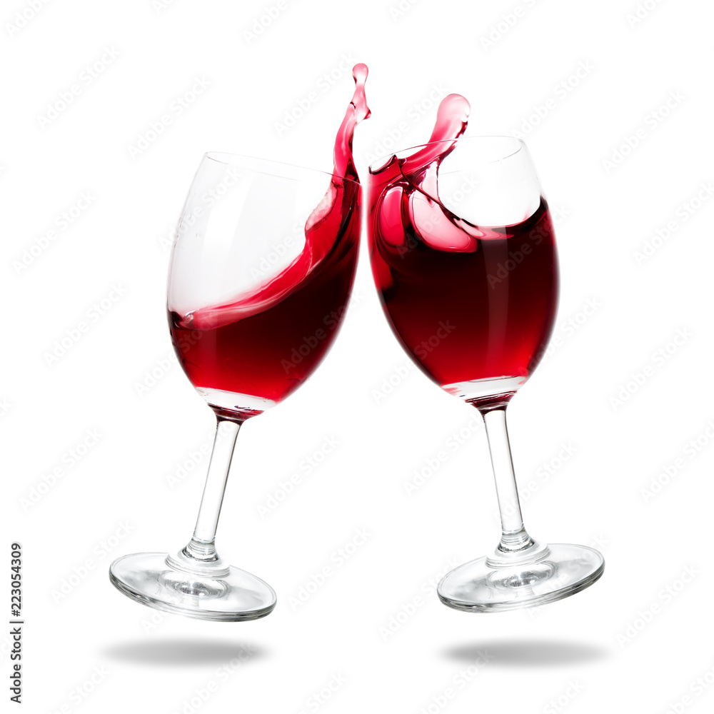 Cheers red wine with splash out of glass isolated on white background