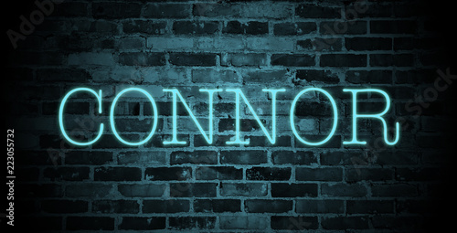 first name connor in blue neon on brick wall photo