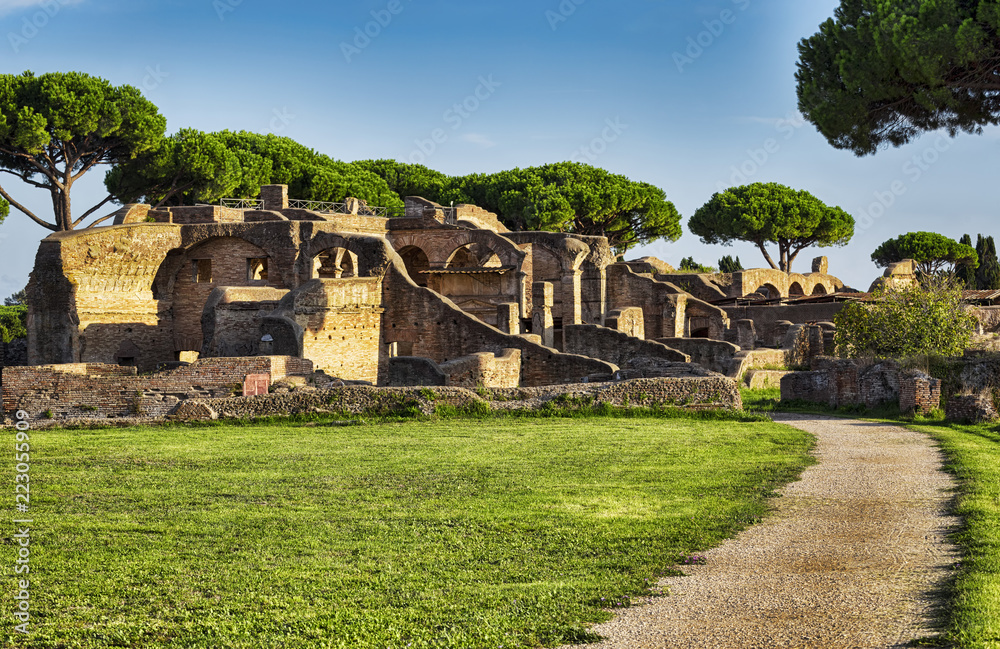 Roman ruins landscape in Ancient Ostia with the tenements of Serapide and the adjacent Seven wise men's spa and the Arrighi's tenement Roman ruins landscape in Ancient Ostia with the tenements of Serapide and the adjacent Seven wise men's spa and the Arrighi's tenement