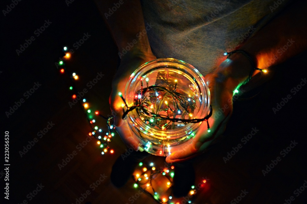 Holding a glass with a light string in it