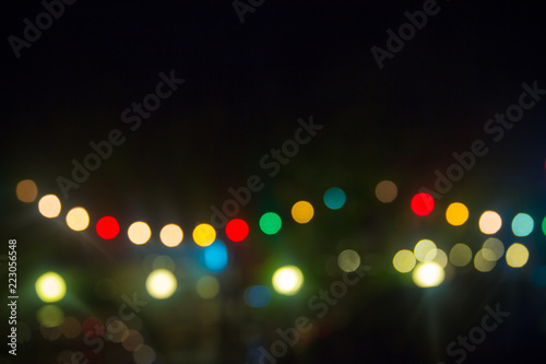 defocused bokeh lights, blur bokeh light, bokeh background. colorful light spot on black background. image for background, wallpaper, copy space. photo