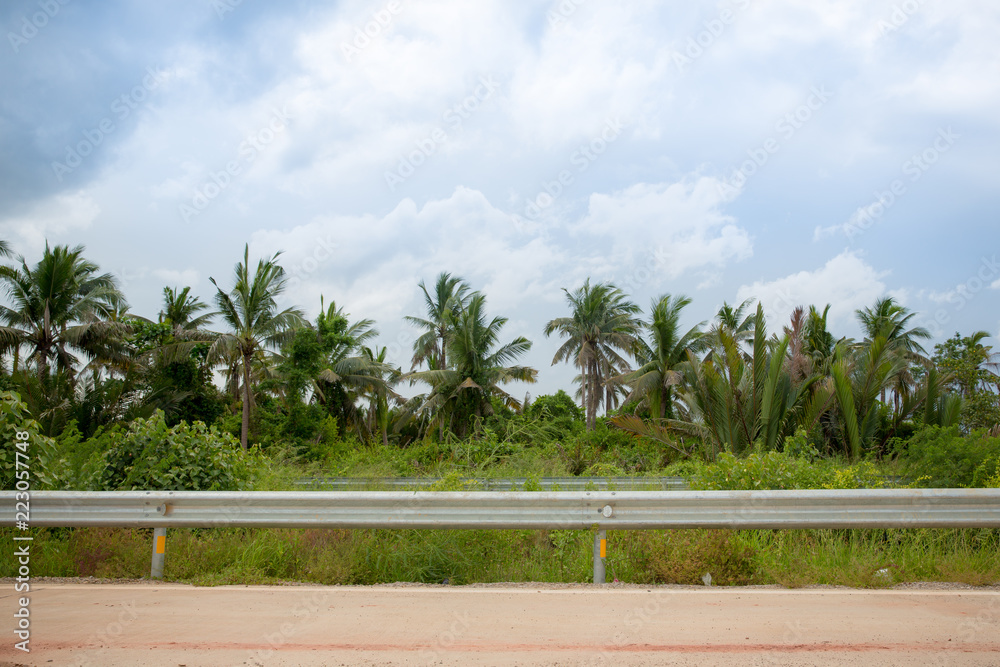 Ocean side highway and gard rail, Behide is beautiful mountain view and  blue  side view mountain and sea  road with mountain  and blue sky view Stock Photo | Adobe Stock