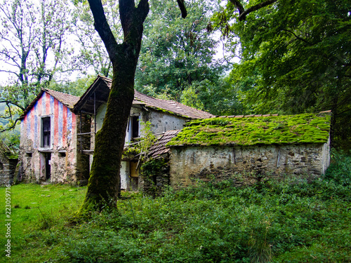 abandoned mountain houses once inhabited by shepherds and peasants, Italy photo