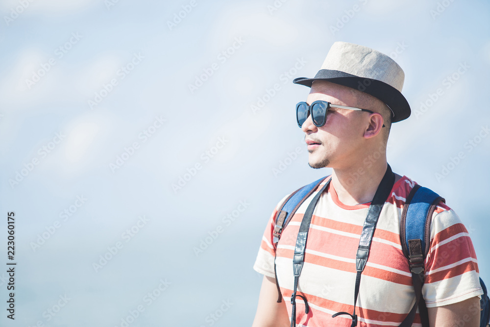 solo traveller wearing summer hat and sunglasses during vacation solo traveller wearing summer hat and sunglasses during vacation