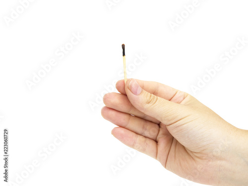 Match in hand on white background. Hand holding matchstick