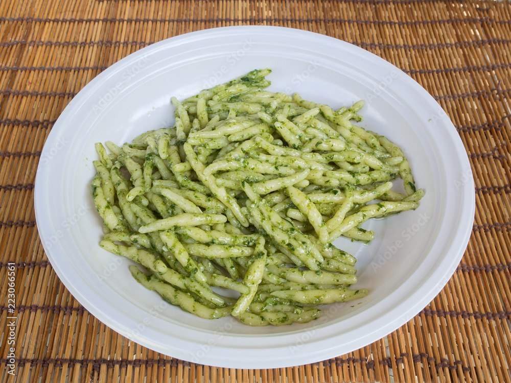 dish of trofie al pesto: handmade pasta with basil sauce dish of trofie al pesto: handmade pasta with basil sauce