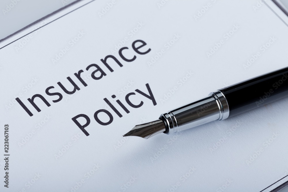 Fountain Pen Lying on the Document of Insurance Policy - Close Fountain Pen Lying on the Document of Insurance Policy - Close