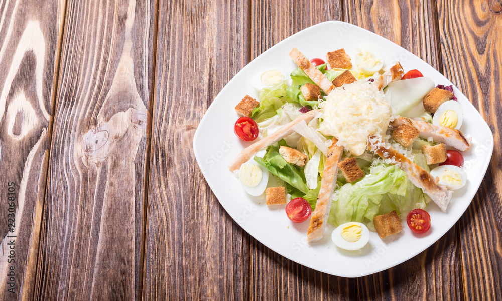 Salad ceasar with chicken , eggs and tomatoes Salad ceasar with chicken , eggs and tomatoes