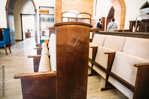 Photography Star of David, Jewish symbol on wooden bench or chair in synagogue