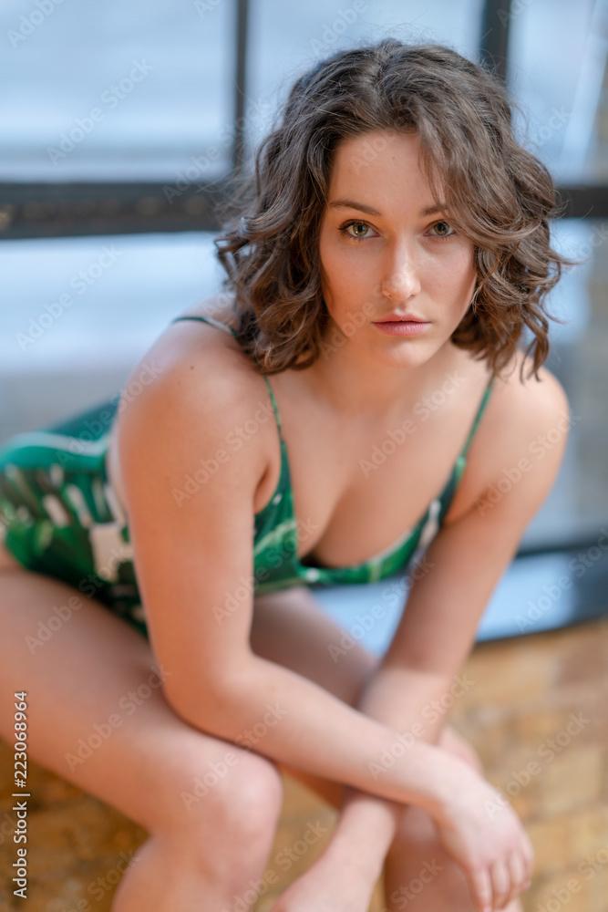 Portrait of girl in green swimsuit