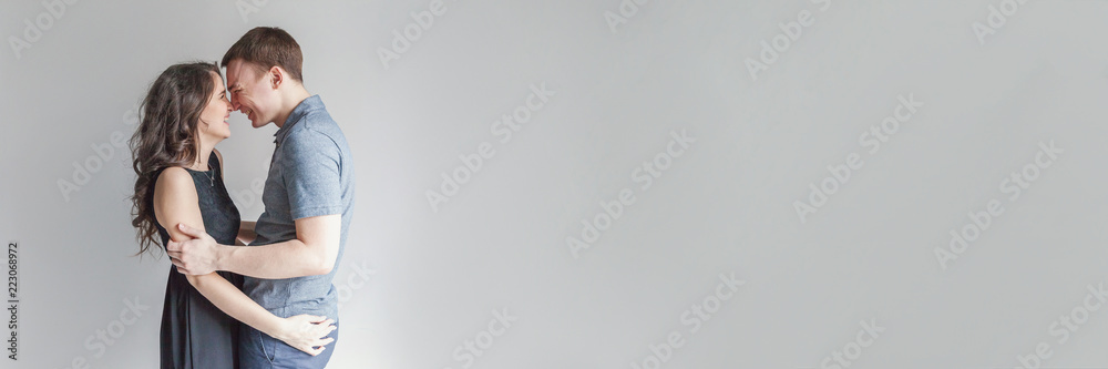Couple in love having nice time together. Young happy woman hugging boyfriend, white background. Students, bride, groom, engagement, relationship, aspirations, supporting relying concept Banner Couple in love having nice time together. Young happy woman hugging boyfriend, white background. Students, bride, groom, engagement, relationship, aspirations, supporting relying concept Banner