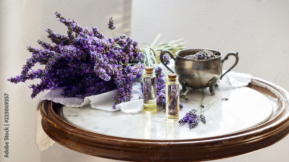 lavender oil bottles,  natural herb cosmetic consept with lavender flowers flatlay on stone background - obrazy, fototapety, plakaty 