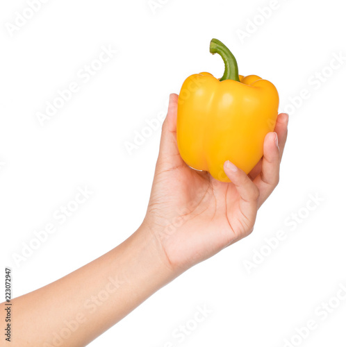 Fotografía hand holding yellow Bell Pepper isolated on white background