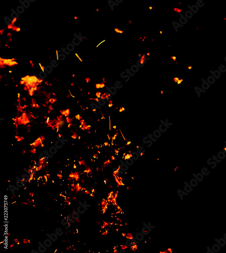 Flame of fire with sparks on a black background