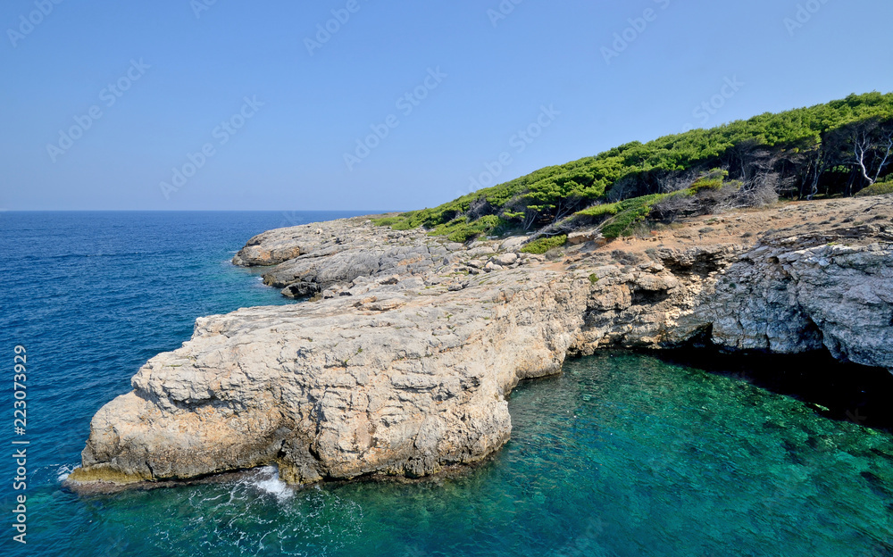 Puglia, Italy, August 2018, a glimpse of north coast of San Domino island of Tremiti archipelago in a sunny day