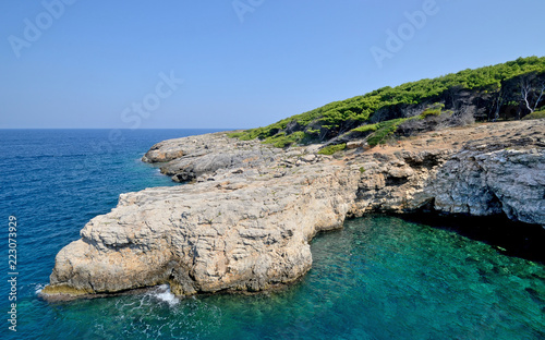 Puglia, Italy, August 2018, a glimpse of north coast of San Domino island of Tremiti archipelago in a sunny day