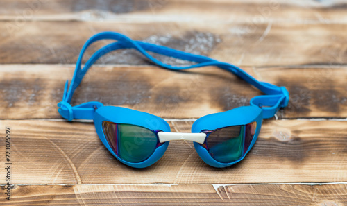 glasses for the pool on a wooden background