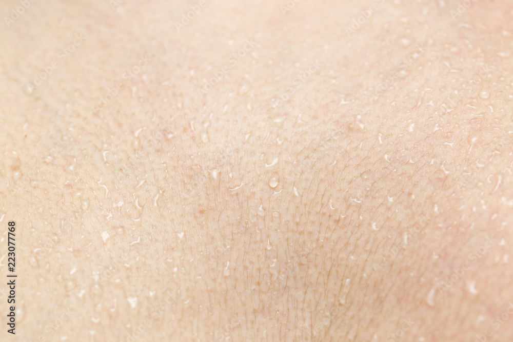 Fototapeta premium Wet human skin with a drop of water