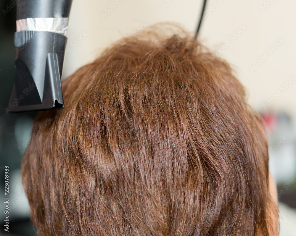 Fototapeta premium wrap hair curling in a beauty salon