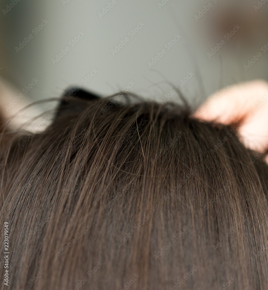 Obraz premium wrap hair curling in a beauty salon