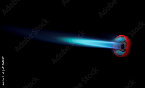 Industrial natural gas burner isolated on black background photo