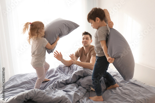 Cute children and father pl...