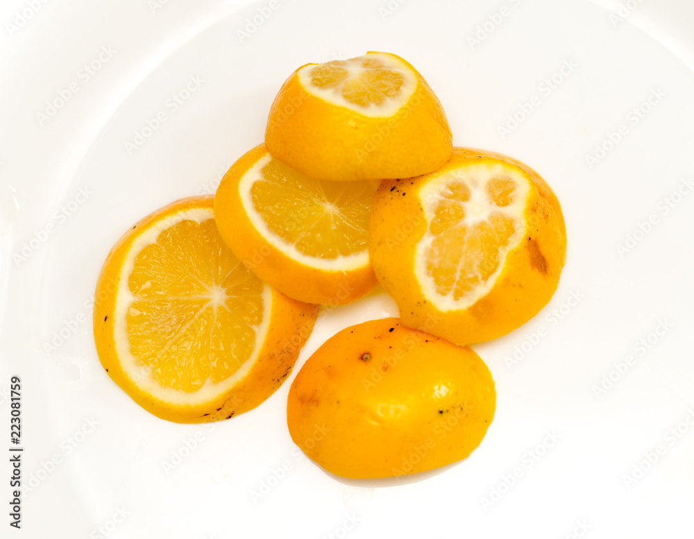 a slice of lemon on a white background a slice of lemon on a white background