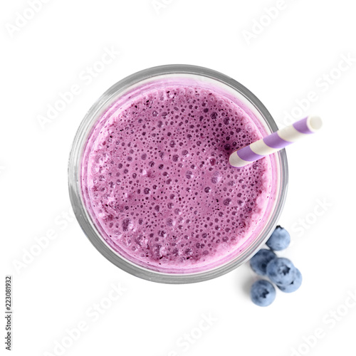 Tasty blueberry smoothie in glass on white background, top view