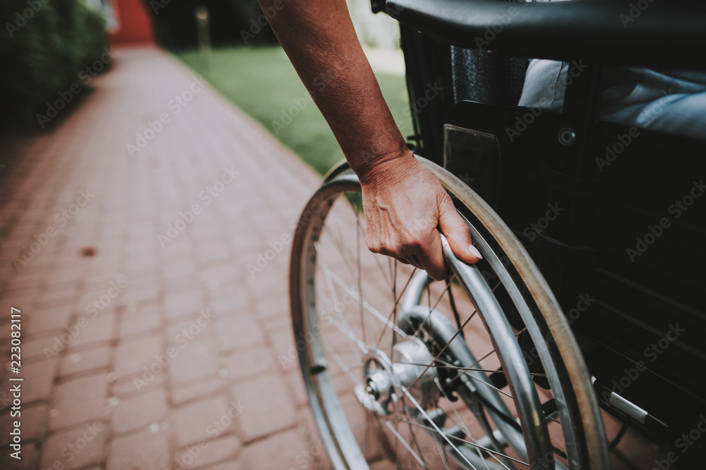 Fototapeta premium Cancer Patient on a Wheelchair. Remission. Clinic.