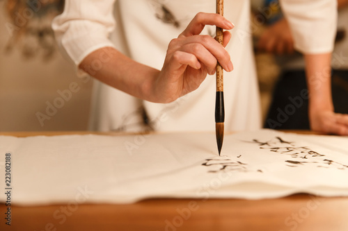 Young women in practice calligraphy photo