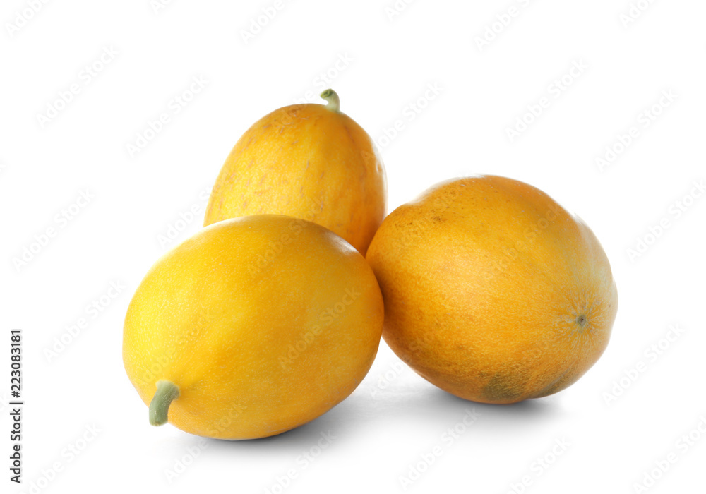 Whole tasty ripe melons on white background