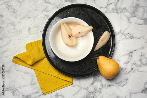 Flat lay composition with ripe pears on marble background